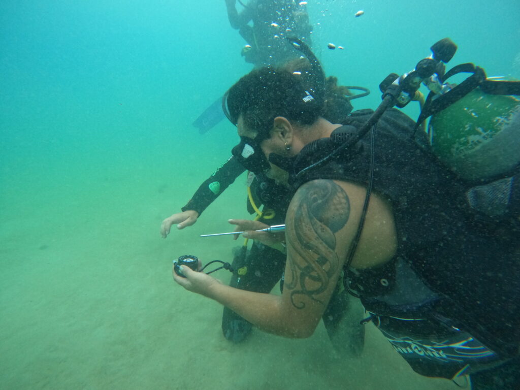 An instructor teaching a student at Galapagos Blue Evolution Dive Center